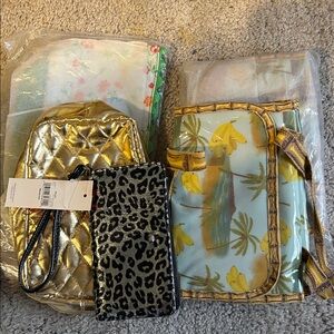 Selling as a group. 4 Avon makeup bags in new condition &a phone wallet included